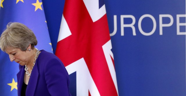 British PM Theresa May walks off the podium during an EU summit in Brussels (Tanjug/AP, file)